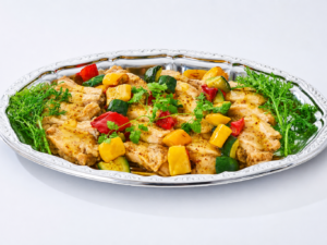 懇親会プランの鶏肉のハニーマスタードグリルを大皿に盛り付けた商品画像